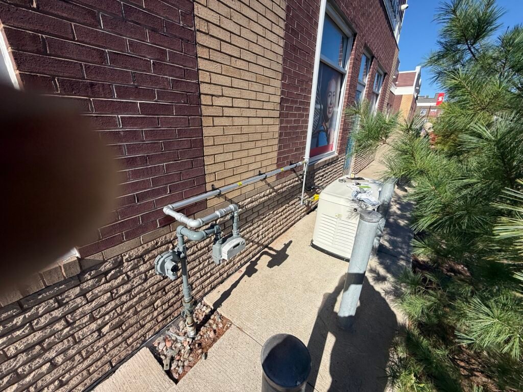 Gas line and meter installation on a commercial building in Nova Scotia