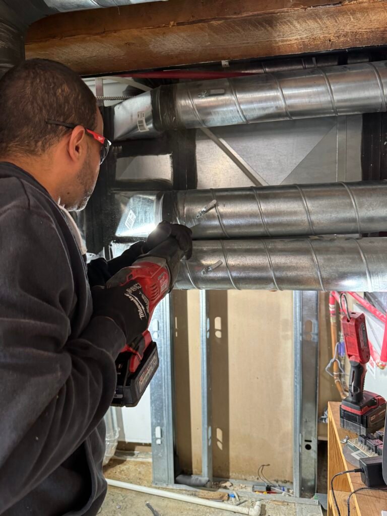 DR Appliance technician at work on an HVAC installation