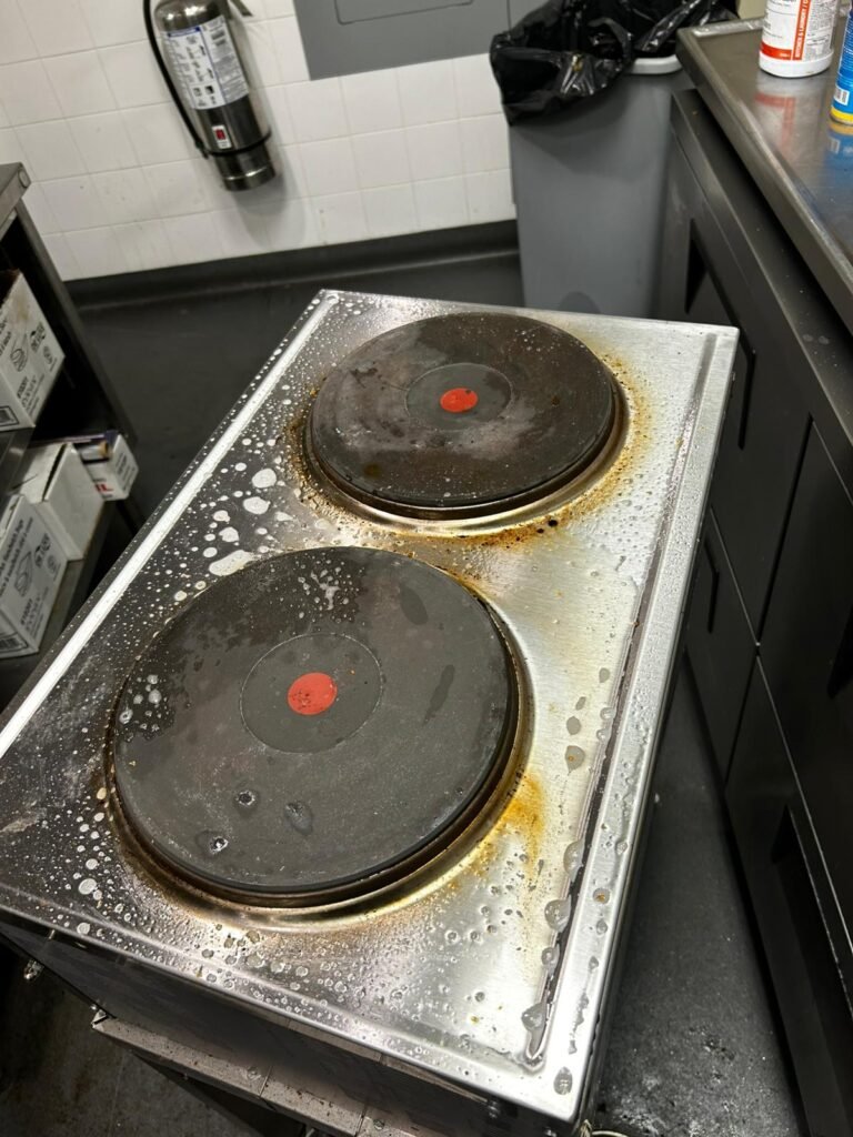 Commercial two-burner electric hot plate before deep cleaning